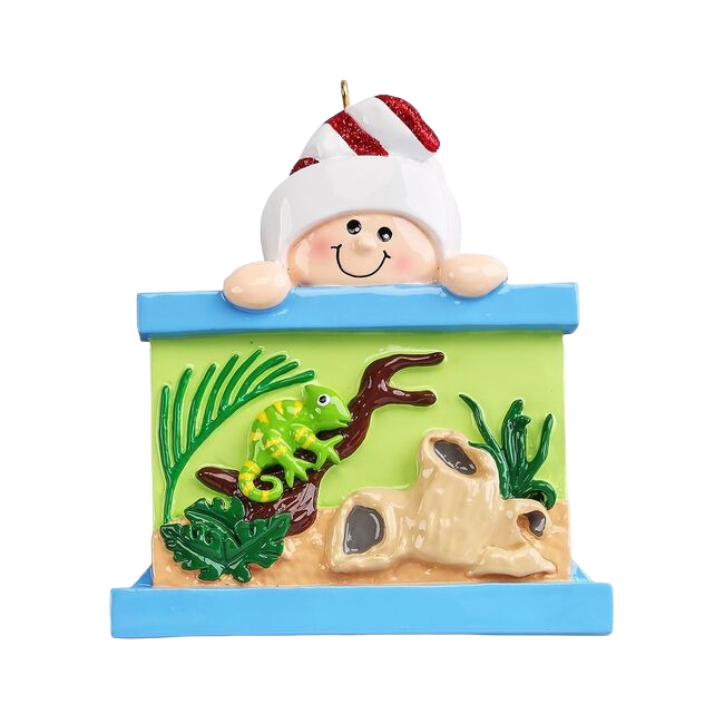 Smiling figure peeking over reptile tank scene with green chameleon, plants, and driftwood from Christmas Ornaments collection