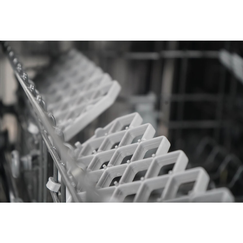 Close-up of empty white plastic dish rack inside a built-in dishwasher in dishwashers and kitchenware collections