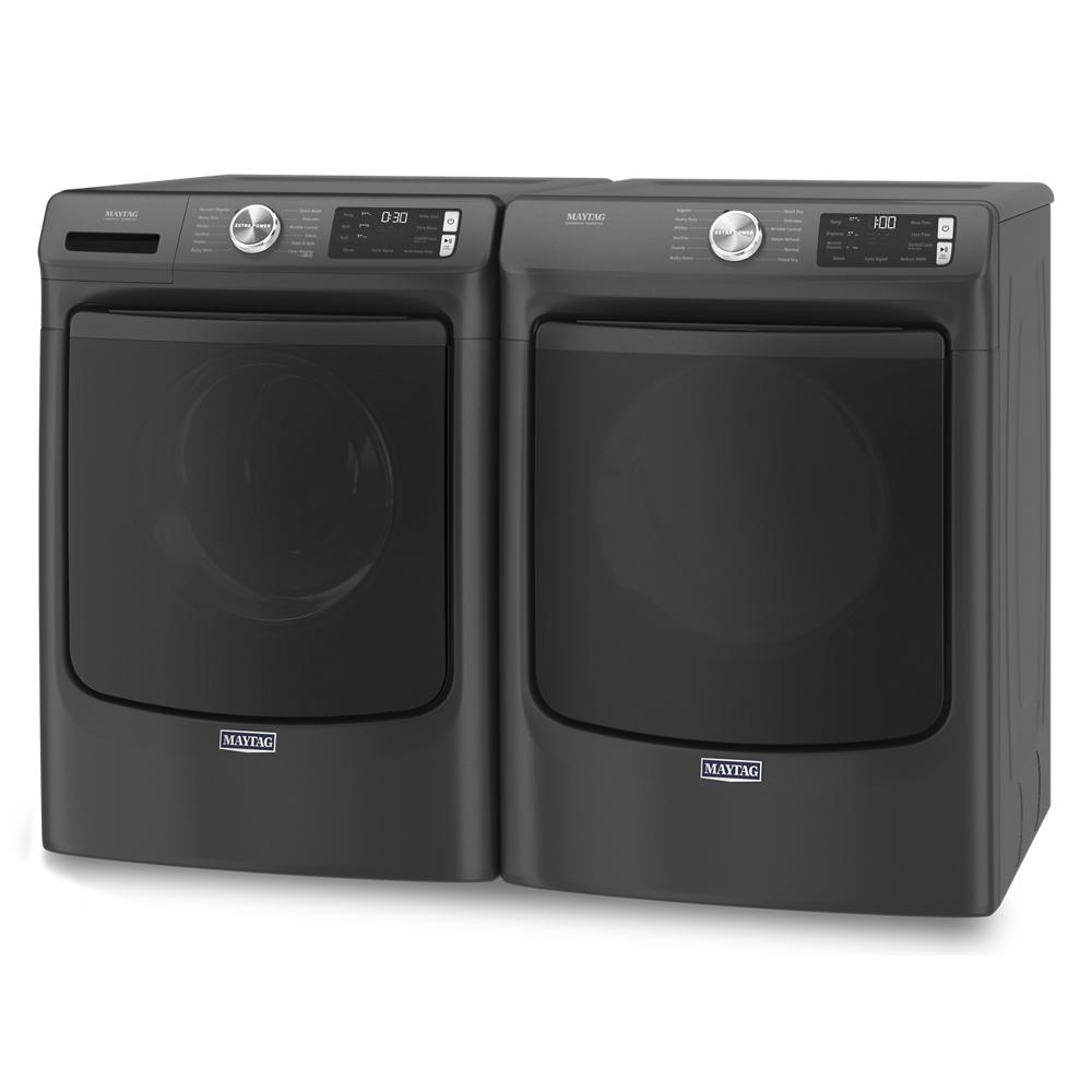 Pair of dark gray front load washer and electric dryer units with digital controls for home appliance use