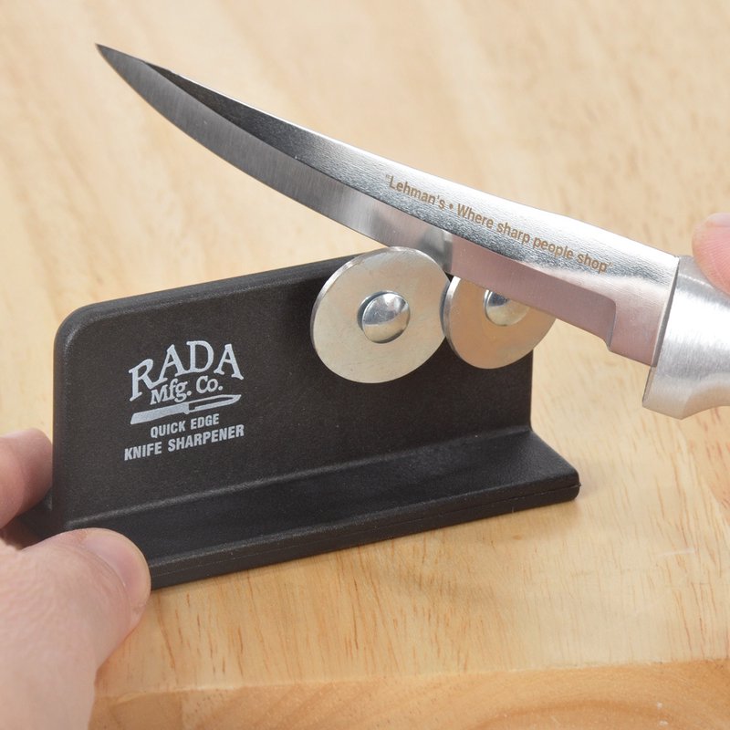 Black Rada Knife Sharpener with metal sharpening discs on wooden surface, part of kitchen gadgets under $50 collection