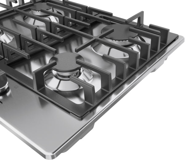 Close-up of stainless steel gas cooktop with four burners and heavy-duty cast iron grates in modern kitchen appliances