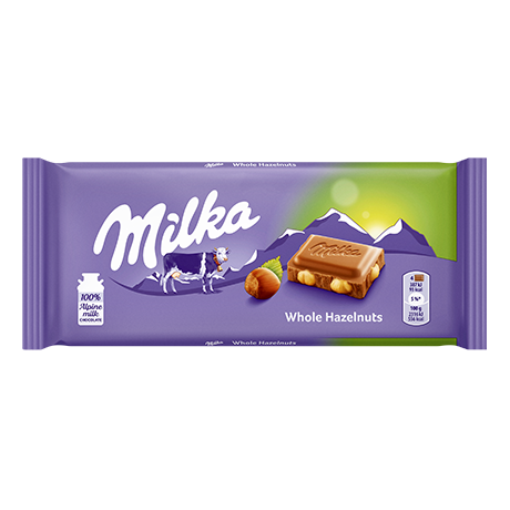 Purple Milka chocolate bar packaging featuring a cow, mountains, and hazelnut chocolate piece with nuts