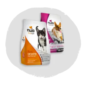 Two bags of pet food, one for cats featuring a gray and white kitten on orange and white packaging, and one for dogs with a tan and white dog on purple and white packaging, shown on a soft gray background.