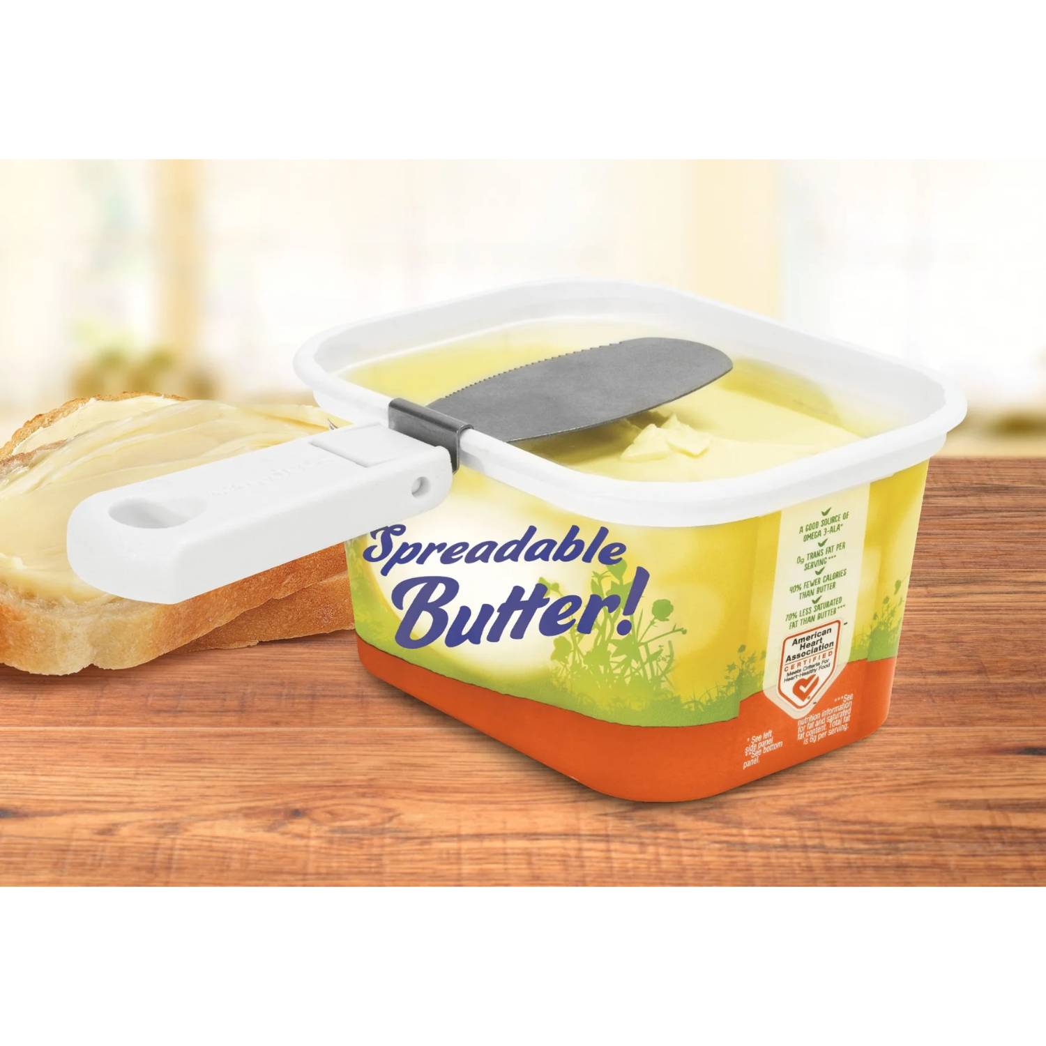 White attachable butter knife with collapsible handle clipped to yellow tub of spreadable butter in kitchenware collection under $50