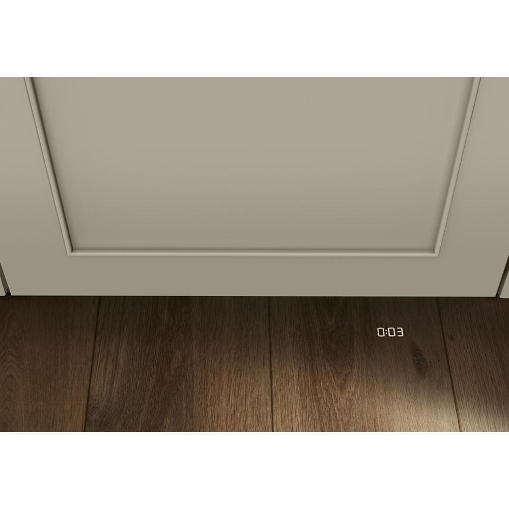 Close-up of a panel-ready dishwasher featuring a flush cabinet design with floor-level digital timer display in appliances collection