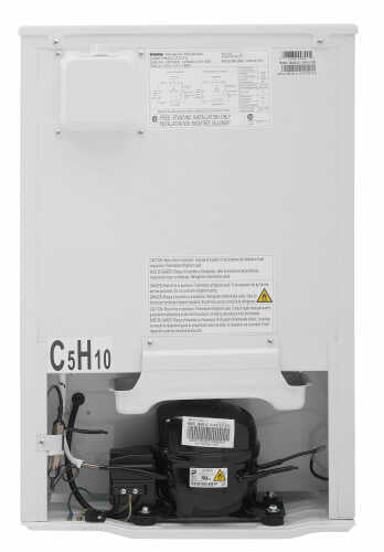 Back view of compact white refrigerator showing compressor and electrical components in appliances collection