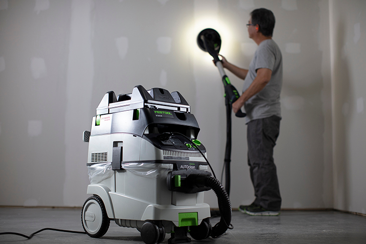 Portable drywall sander with dust extraction unit and ergonomic handle for efficient home improvement tasks