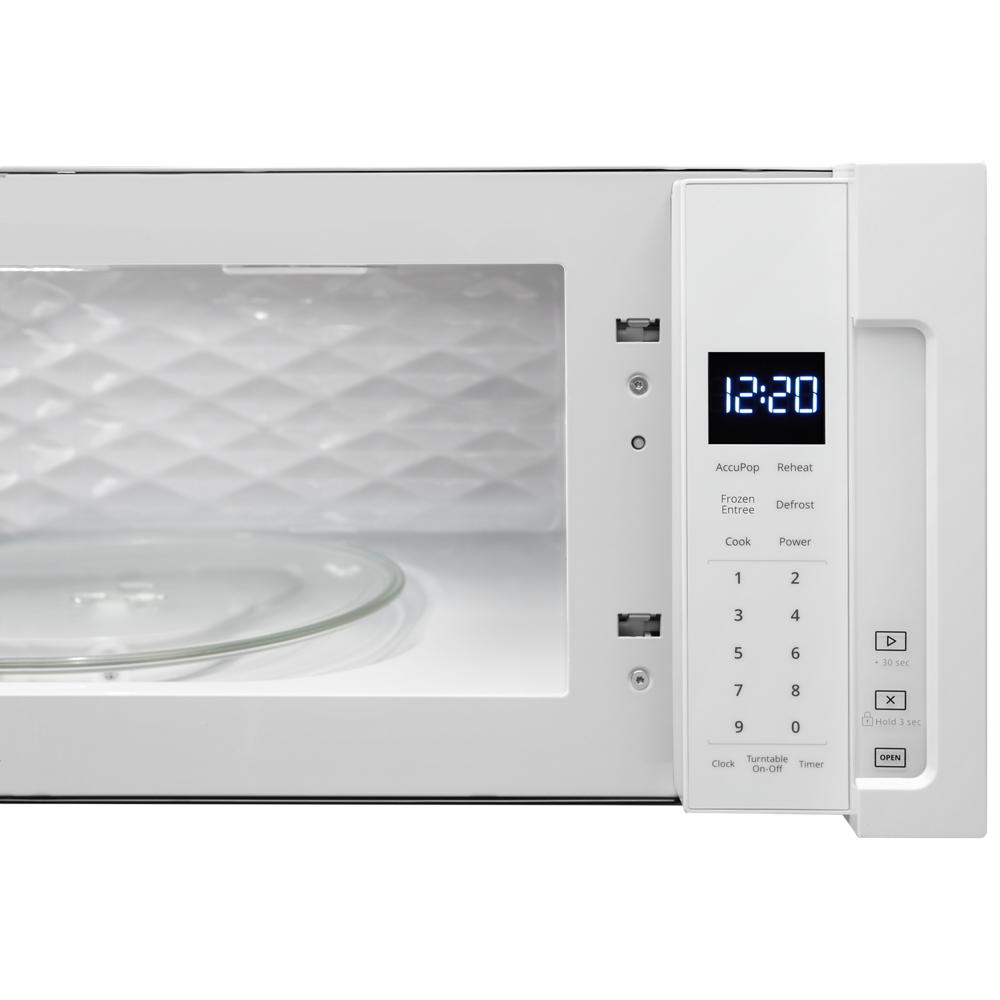 White over-the-range microwave with digital clock display and control panel from kitchen and appliances collections