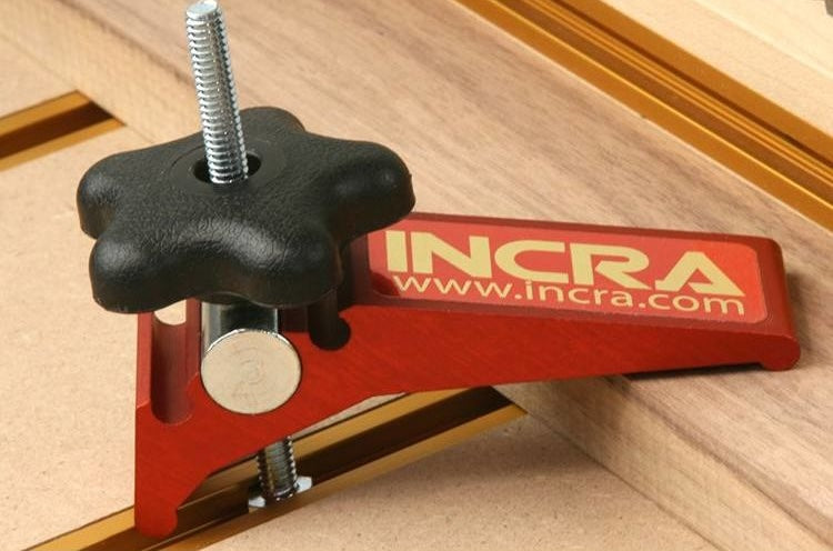Red aluminum clamp with black star-shaped knob for woodworking and clamping tools under $100 collections