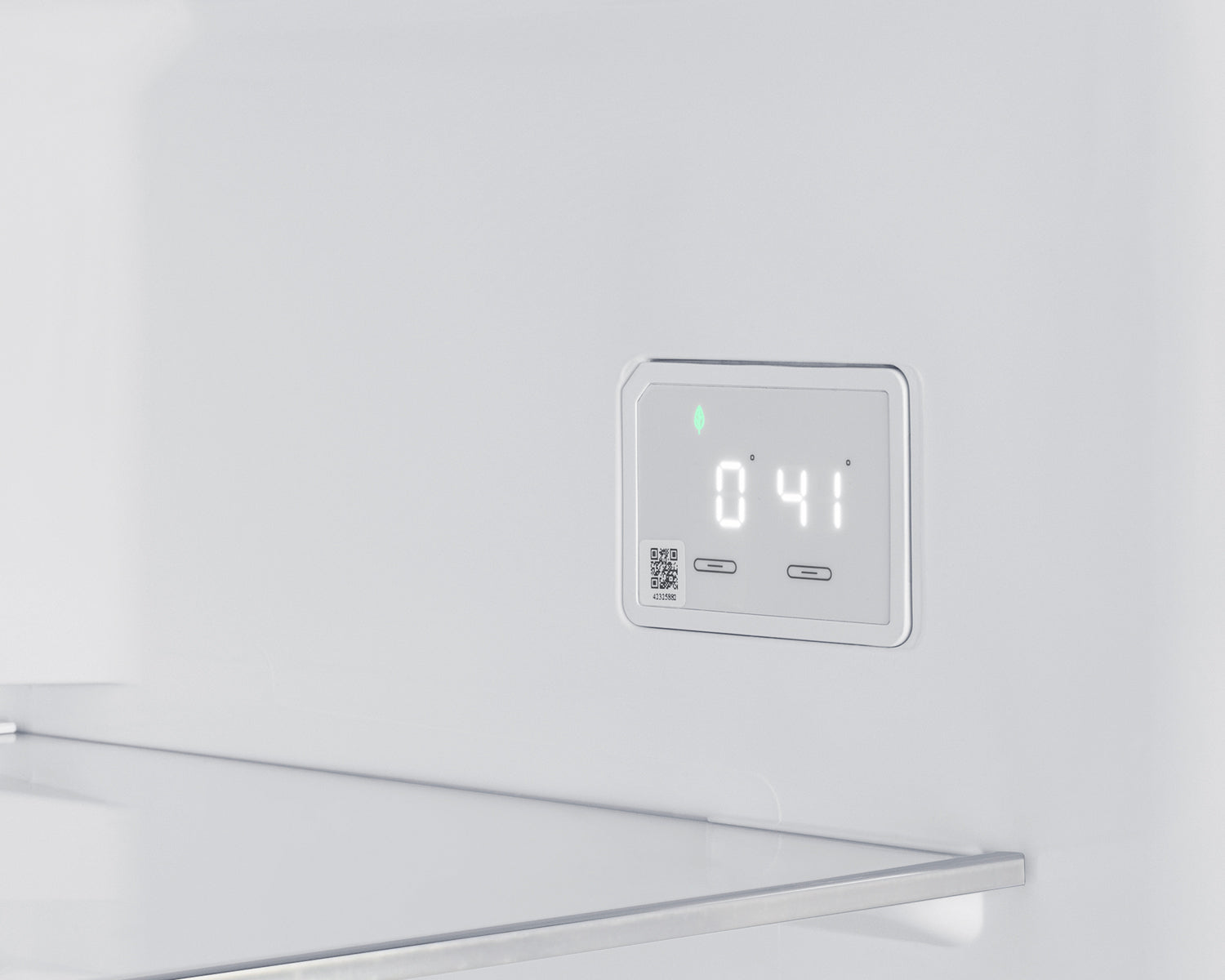 Digital temperature control panel inside a stainless steel bottom freezer refrigerator in kitchen appliances collection