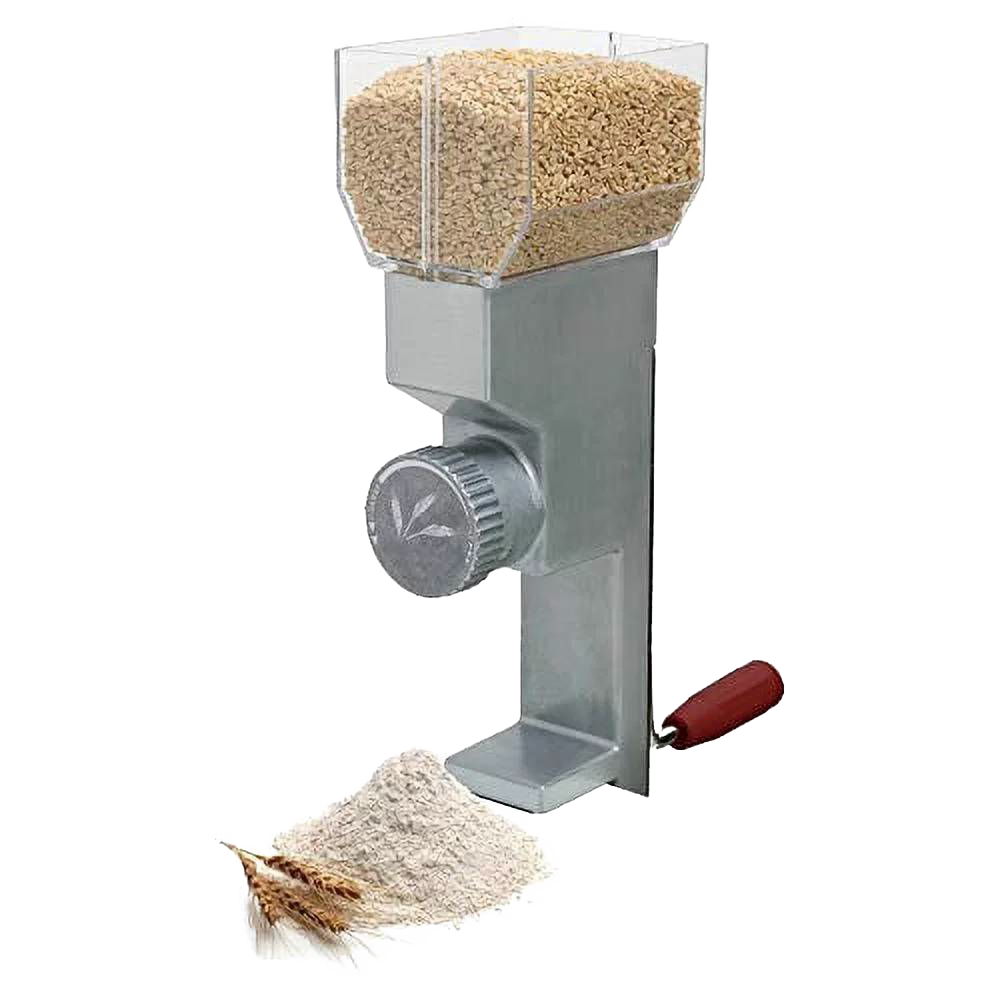 Metal grain mill with clear hopper filled with grains, red handle, and pile of freshly ground flour for kitchen gadgets collection
