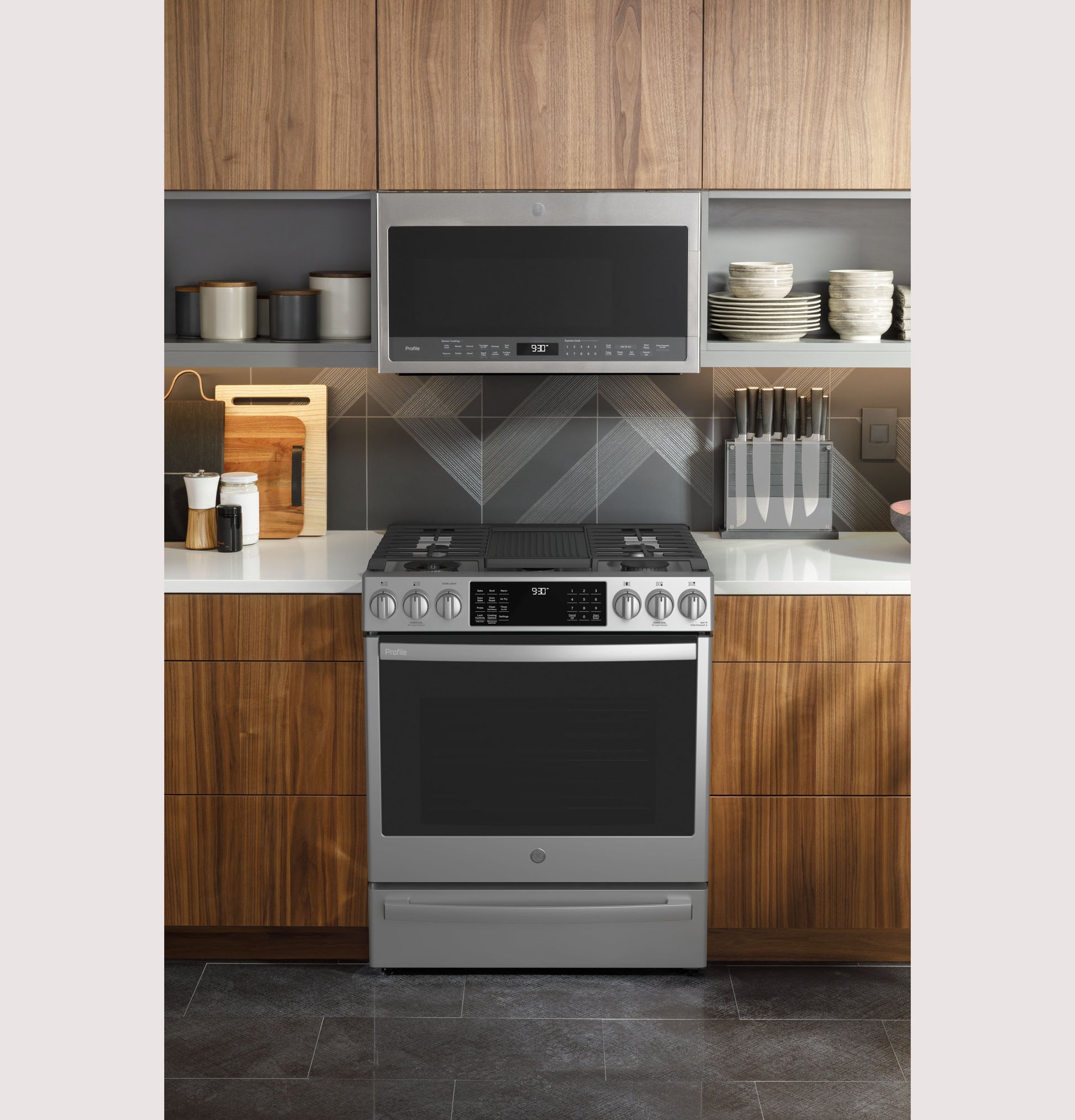 Fingerprint-resistant stainless steel gas range with front controls and digital display in modern kitchen setting for home improvement.