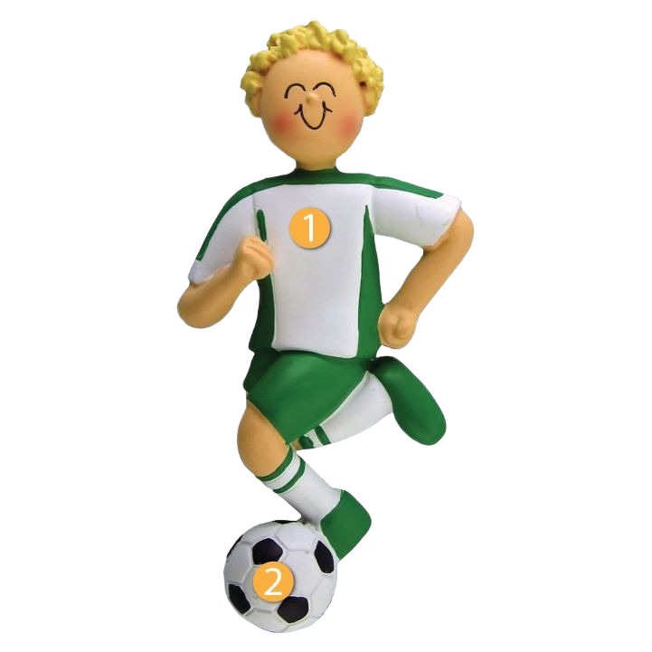 Blonde boy figurine in green and white soccer uniform kicking a black and white soccer ball for Christmas decor collection