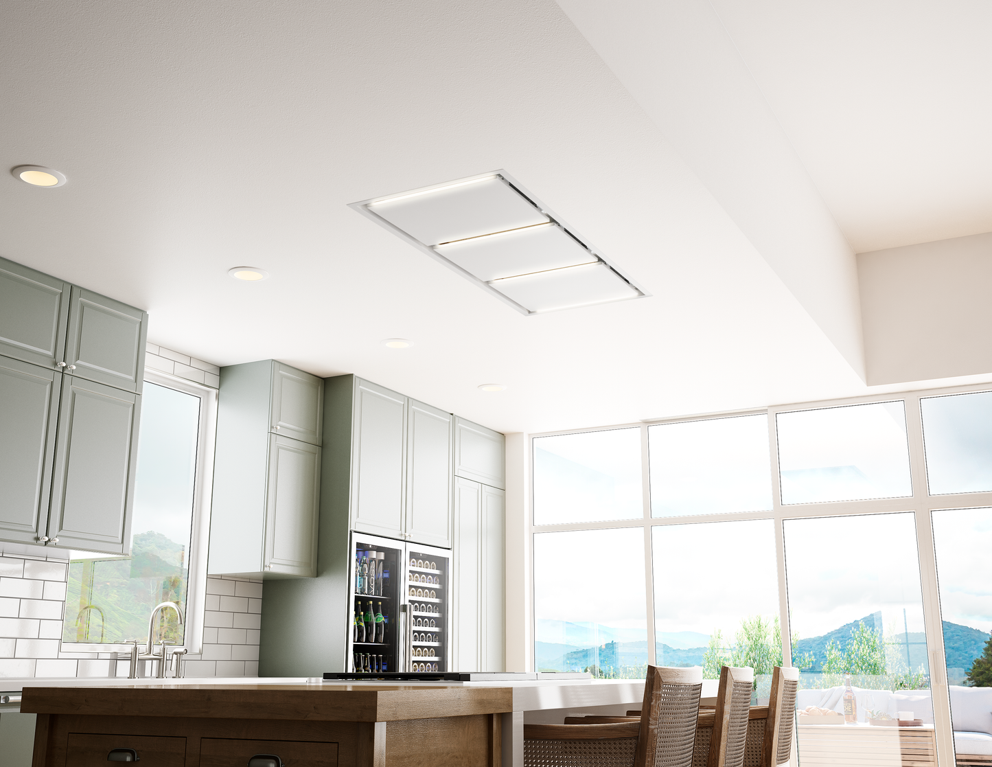 Modern minimalist ceiling-mounted LED kitchen hood above island with natural light in bright kitchen setting