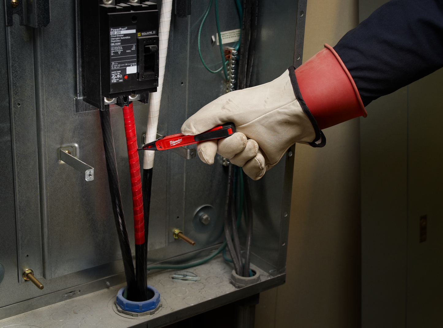 Red voltage detector in use inside an electrical panel for residential and commercial electrical testing tools collections