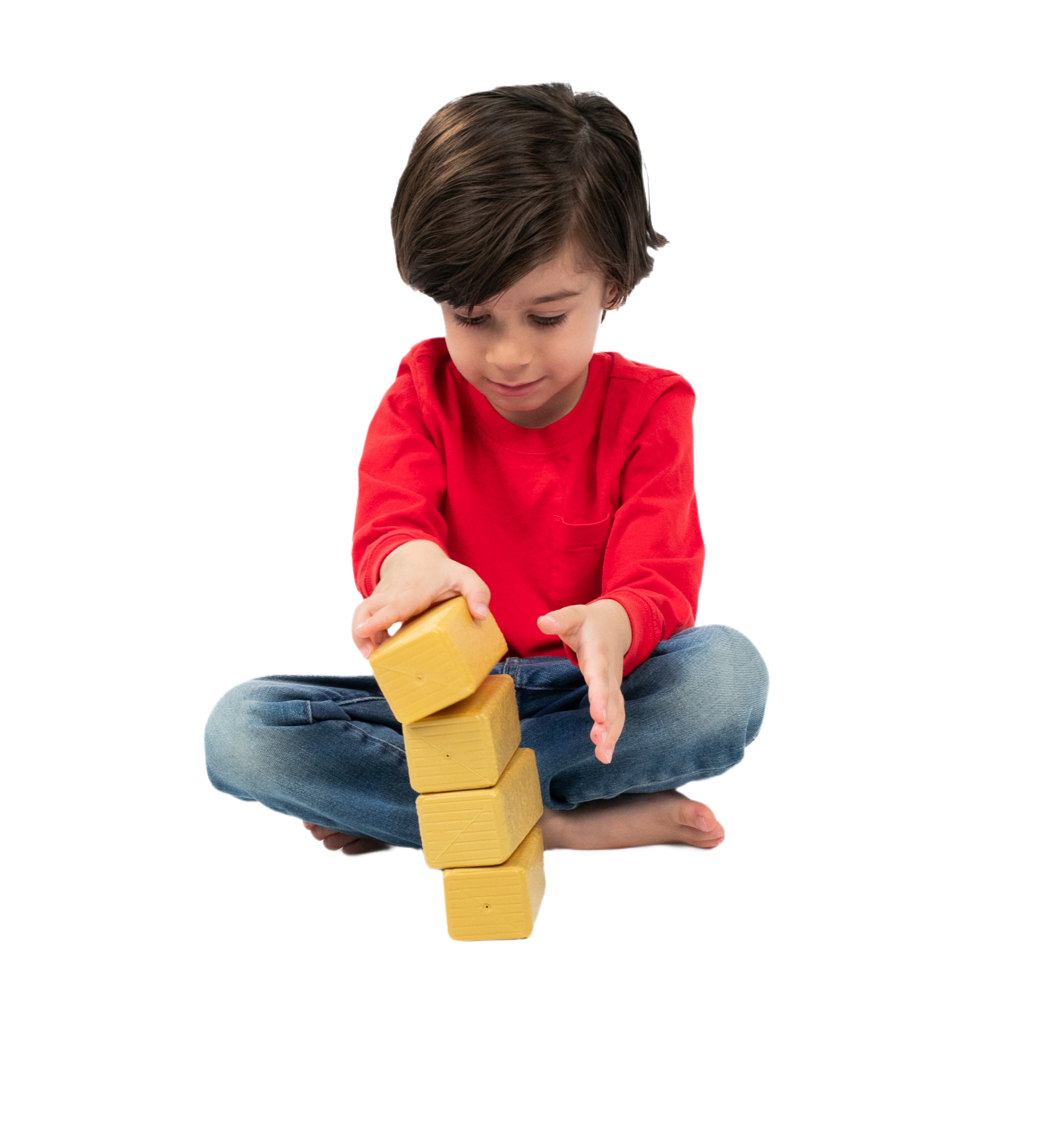 Child in red shirt and jeans stacking four light tan wooden hay bale replicas for play or display use