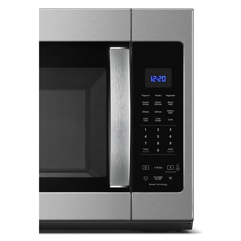 Close-up of stainless steel microwave door and digital control panel with sensor cooking and steam options for kitchen use