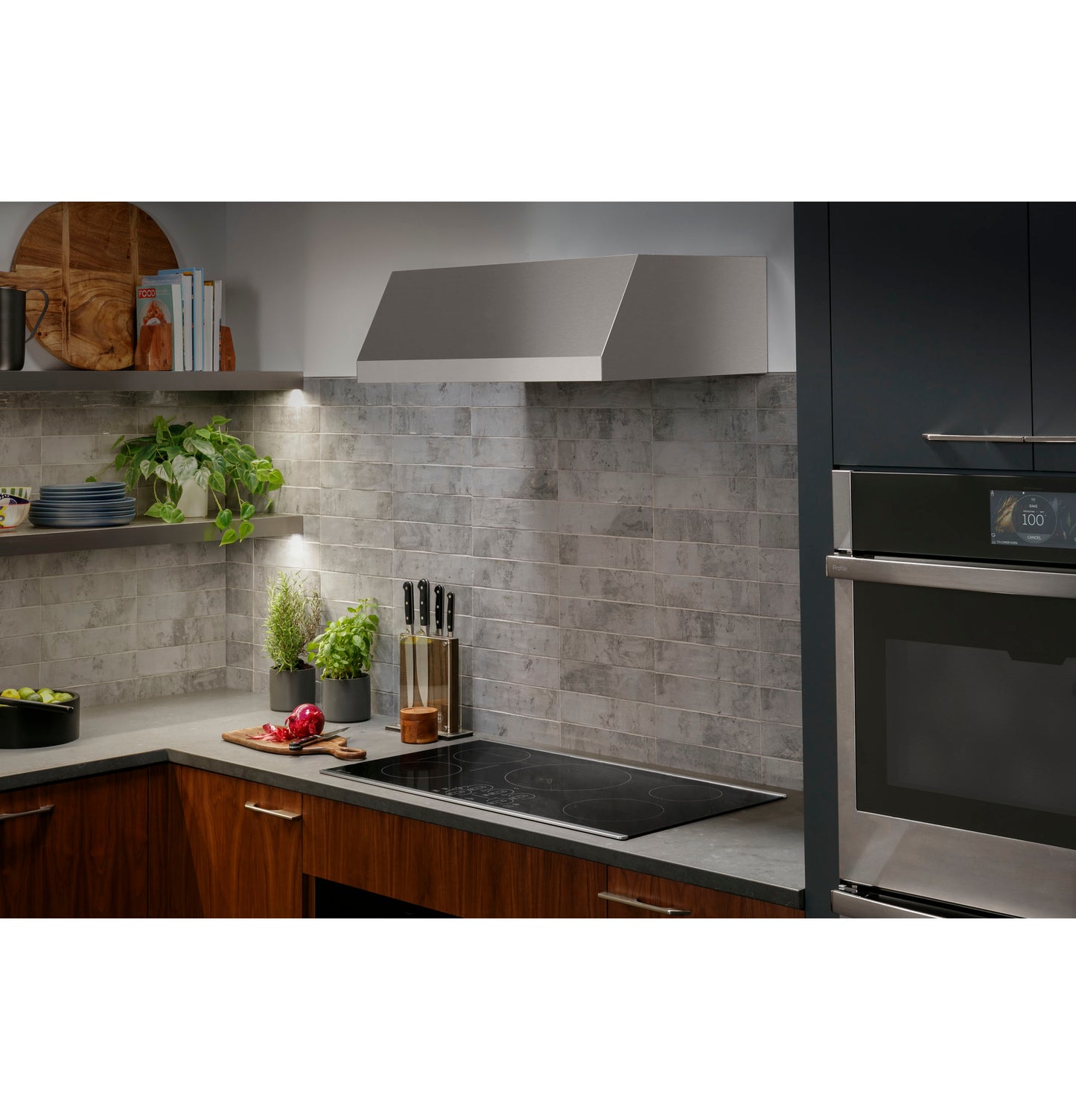 Sleek built-in induction cooktop with touch controls set in modern kitchen featuring wood cabinets and gray tile backsplash