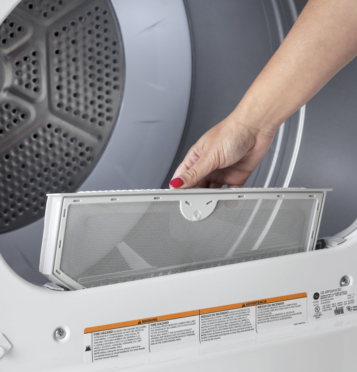 Hand removing lint filter from aluminized alloy drum electric dryer in home appliances and washers & dryers collection