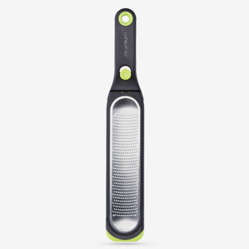 Stainless steel handheld kitchen zester with black and green ergonomic handle for cooking utensils under $50 collections