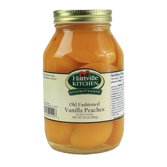 Glass jar of Hartville Kitchen Old Fashioned Vanilla Peaches in syrup from jams and jellies food collection