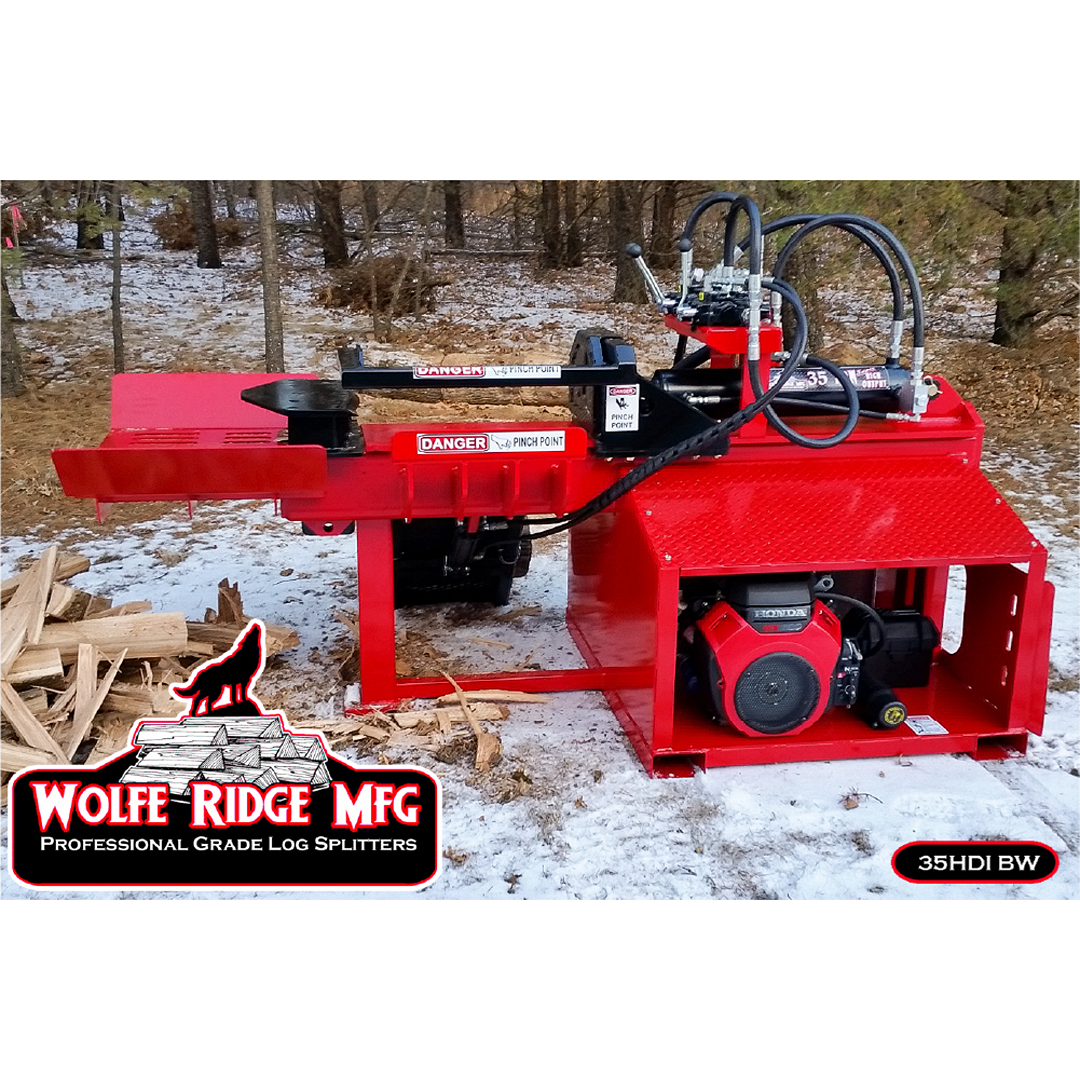 Red Wolfe Ridge heavy-duty log splitter with hydraulic controls and Honda engine outdoors near woodpile in snowy forest
