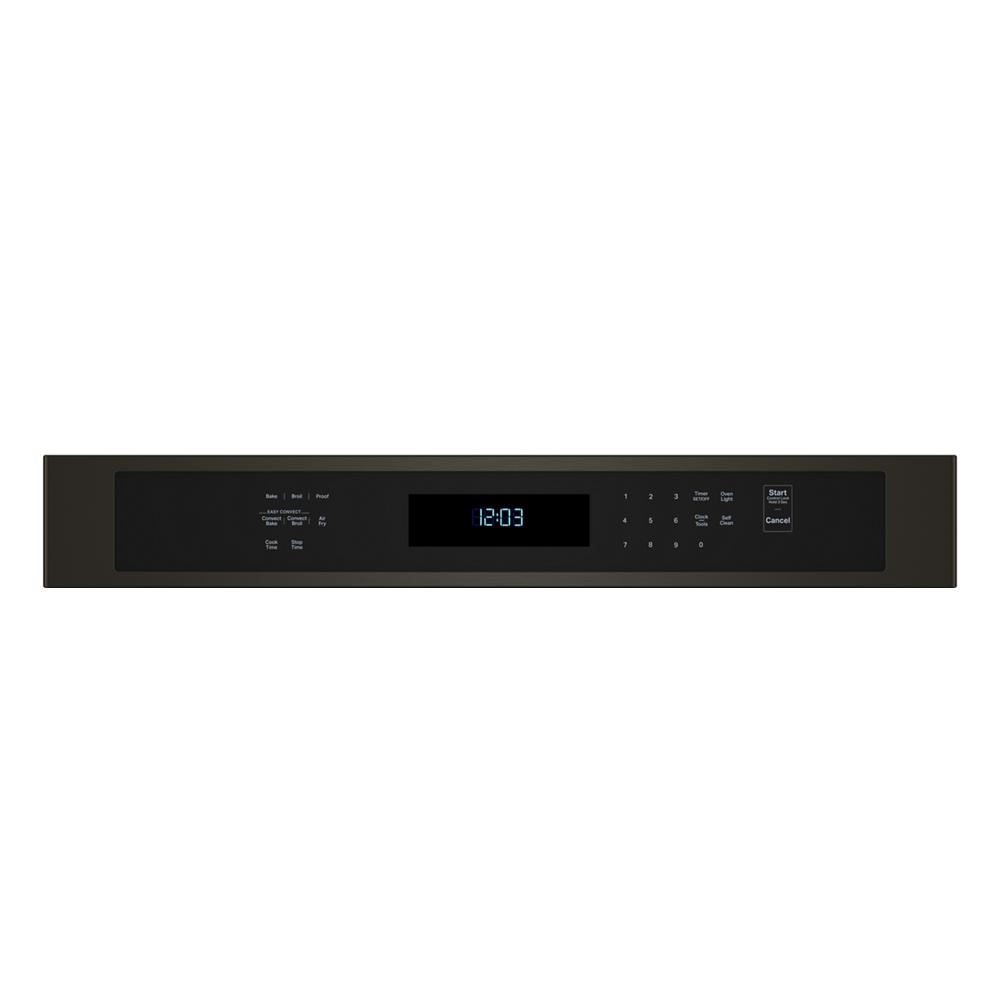 Control panel of a black wall oven with digital clock and touchpad buttons in KitchenAid appliances collection