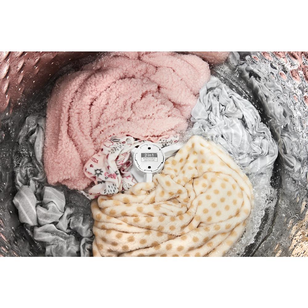 Inside view of top load washer drum with assorted soft fabrics and 2 in 1 removable agitator in appliances collection