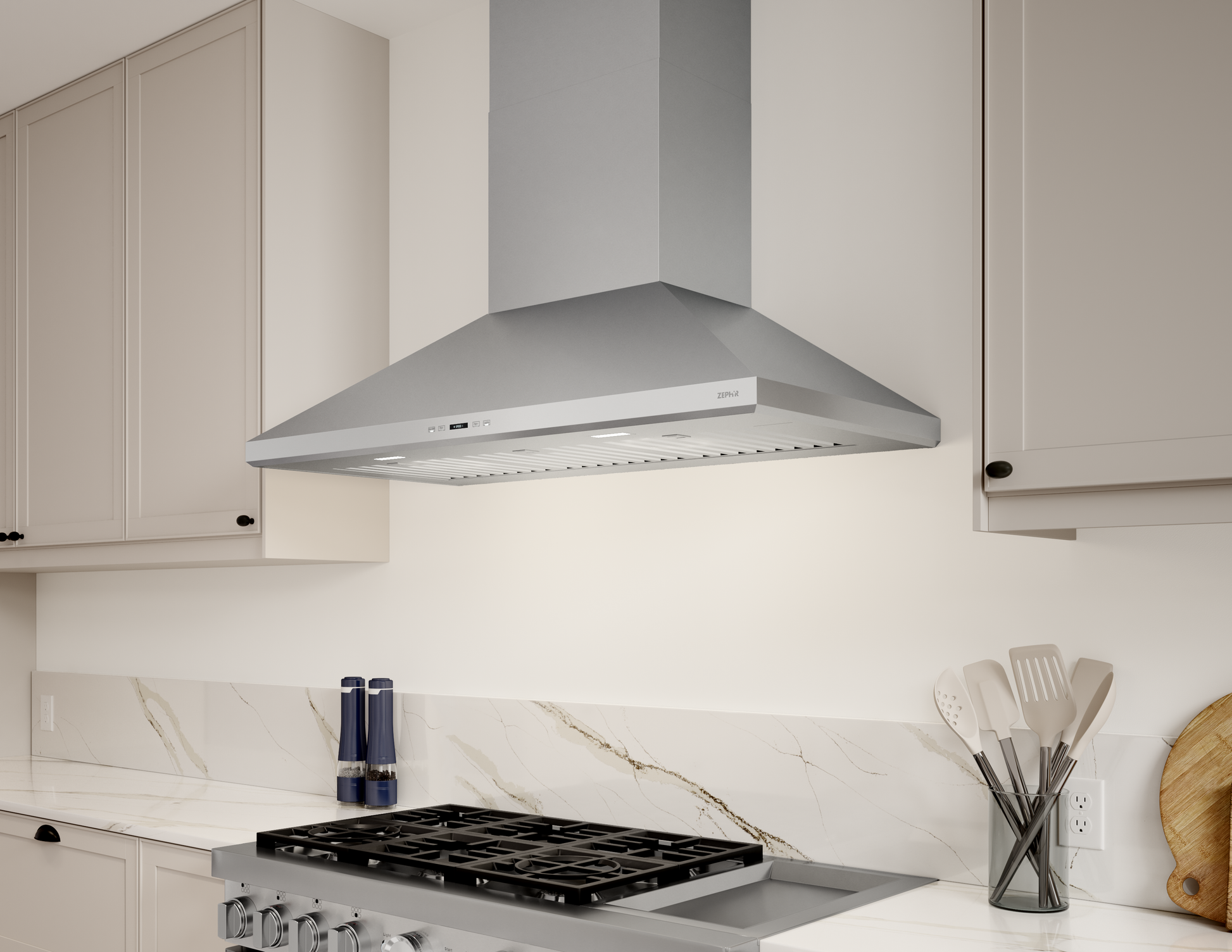 Stainless steel wall mounted range hood with LED lights installed above a gas cooktop in a modern kitchen setting.