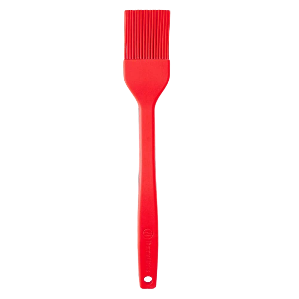 Red high-temperature silicone brush with flexible bristles and ergonomic handle for cooking and home improvement tasks