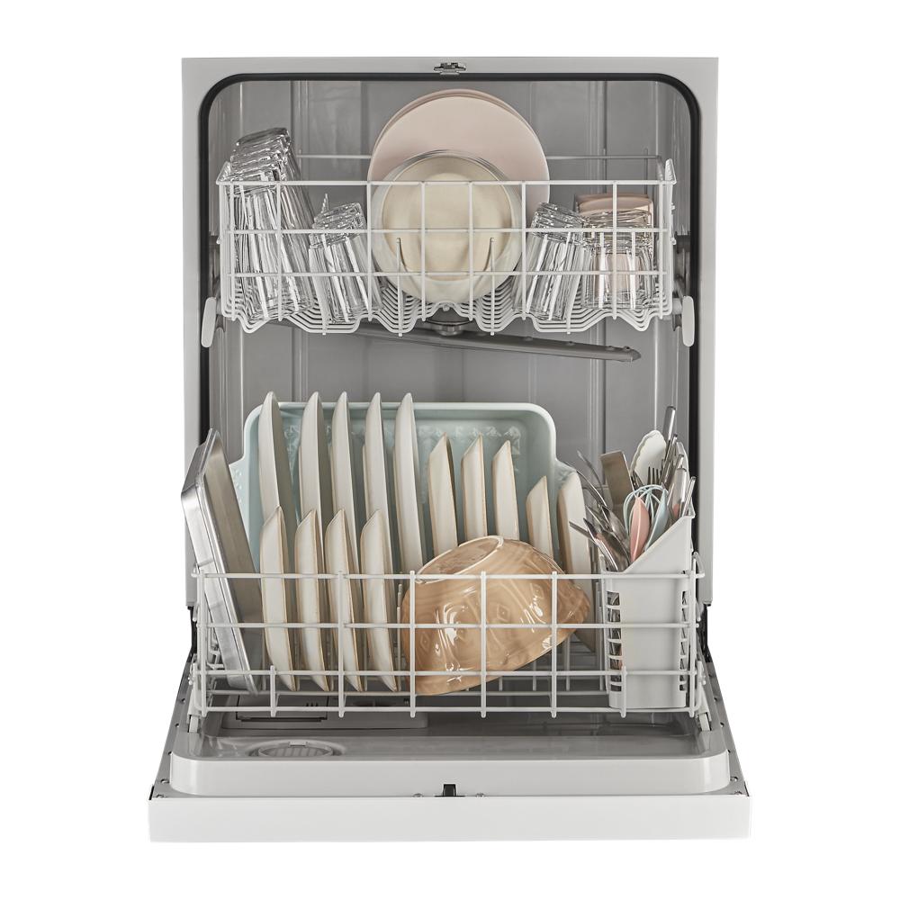Open dishwasher interior loaded with clean plates, bowls, glasses, and utensils in racks for kitchen appliances collection