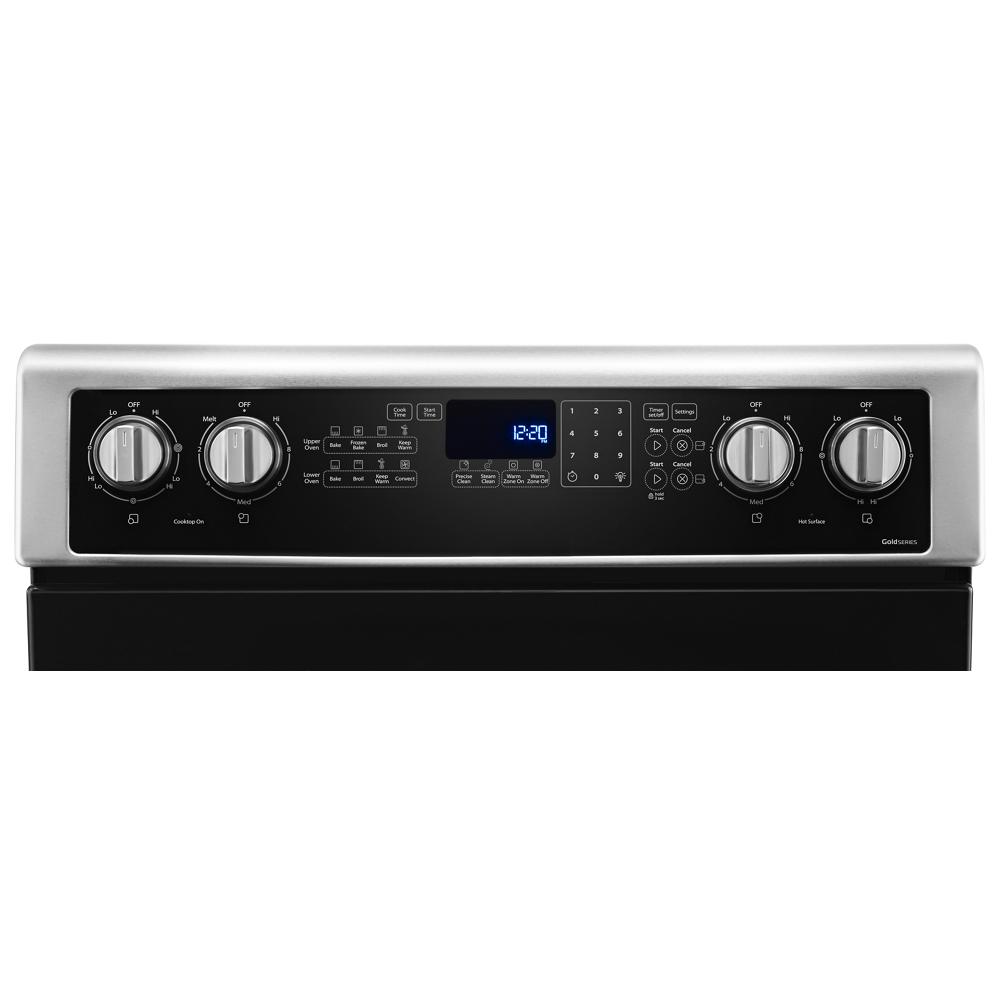 Control panel of a stainless steel electric double oven range with digital display and knob controls in Appliances collection