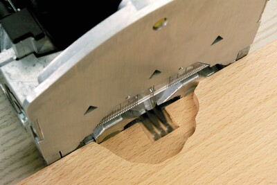 Close-up of a Festool joinery tool creating precise mortise cuts on hardwood for woodworking and home improvement projects