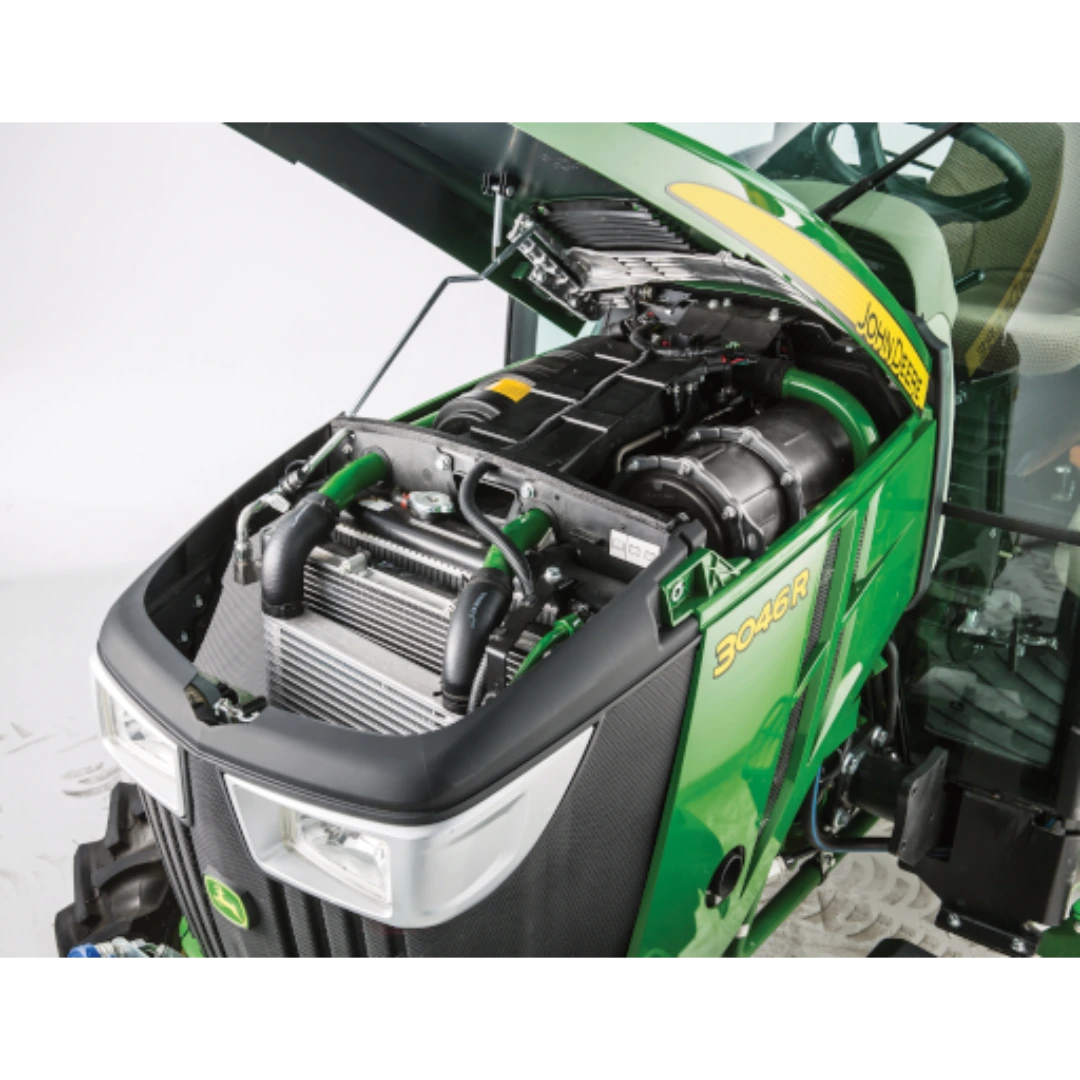 Open hood view of a green John Deere 3046R compact tractor showing the Yanmar 3-cylinder engine and front grill, displayed in Outdoor Power Equipment at Hartville Hardware.