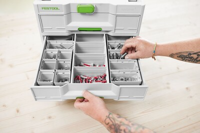 White and green Festool tool organizer with multiple compartments and drawers for workshop and woodworking tools storage