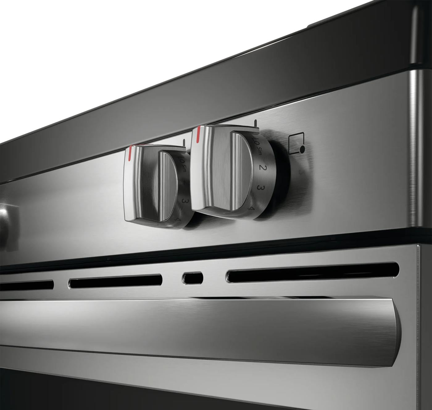 close-up of stainless steel electric range control knobs with temperature settings in kitchen appliances collection