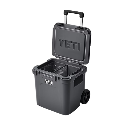 Black wheeled hard cooler with telescoping handle and spacious insulated interior for food storage and organization collections