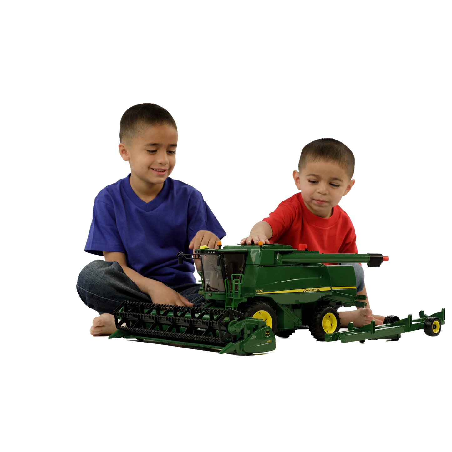 Two boys playing with a green Bruder John Deere T670i combine harvester toy in Vehicles & Remote Controlled Toys collection