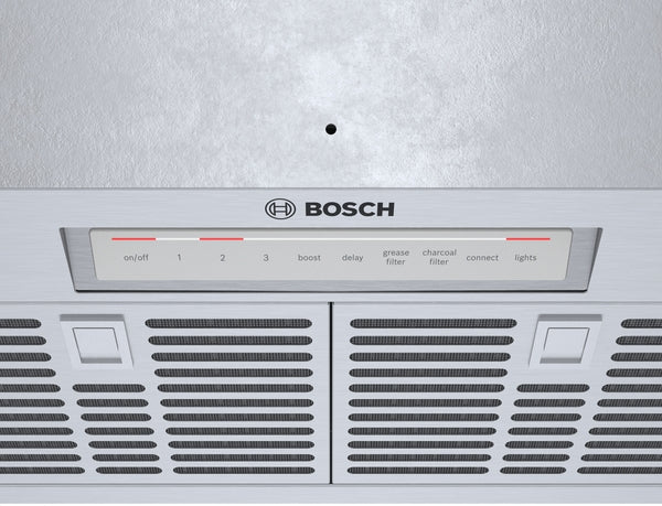 Control panel and stainless steel vent grille with multiple functions for a Bosch range hood in modern kitchen setting