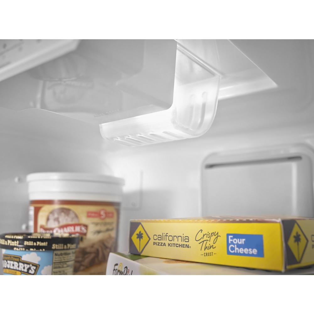 Interior view of upright freezer showing frozen food containers including ice cream and frozen pizza in appliances collection