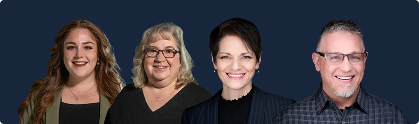 Four smiling individuals standing side by side against a dark blue background, dressed in casual and business casual attire.