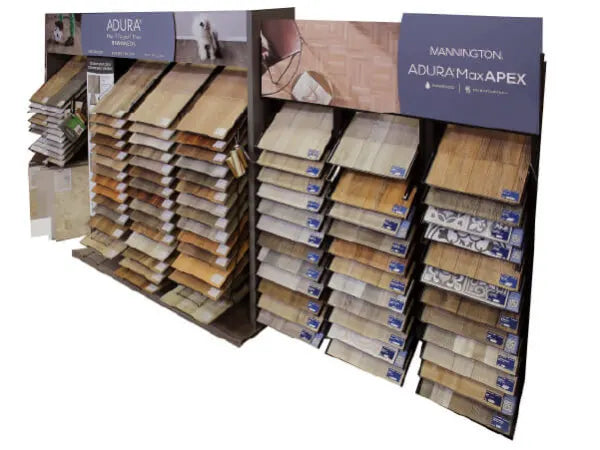 Display racks featuring a selection of wood-look and patterned flooring samples in various natural and warm tones for home improvement projects.