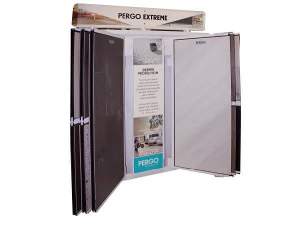 Freestanding display featuring large, hinged sample panels in dark and light wood tones with informational signage about flooring durability.