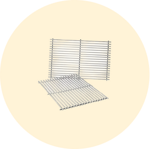 Two clean stainless steel grill racks arranged on a light beige circular background, showcasing their parallel bars and open design.