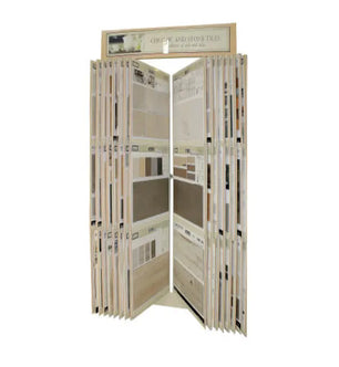 Tall display rack holding multiple panels of ceramic and stone tile samples in various neutral shades for home improvement projects.