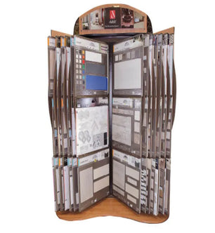 Freestanding display rack holding a variety of tile sample boards featuring different colors, textures, and patterns for home improvement projects.